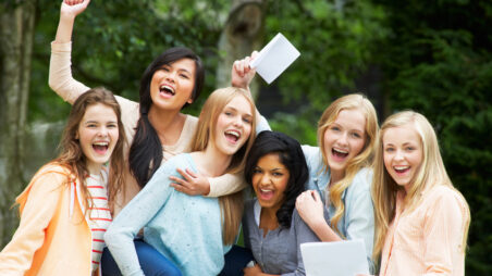 Six Teenage Girls Celebrating Successful Exam Results
